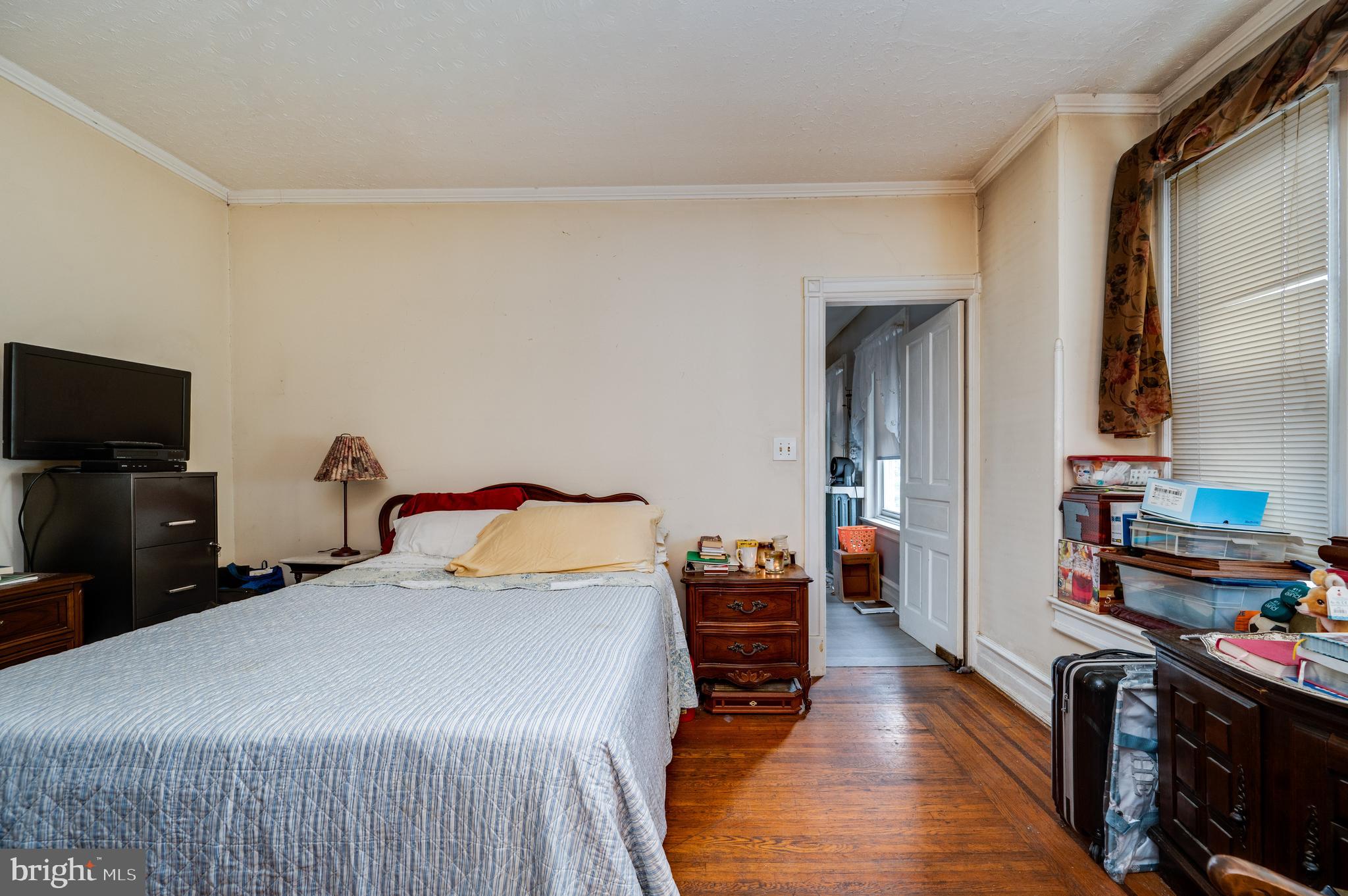 1642 Mineral Spring Road Reading, PA 19602 - Photo 11 of 56 a bedroom with a bed and a tv on table