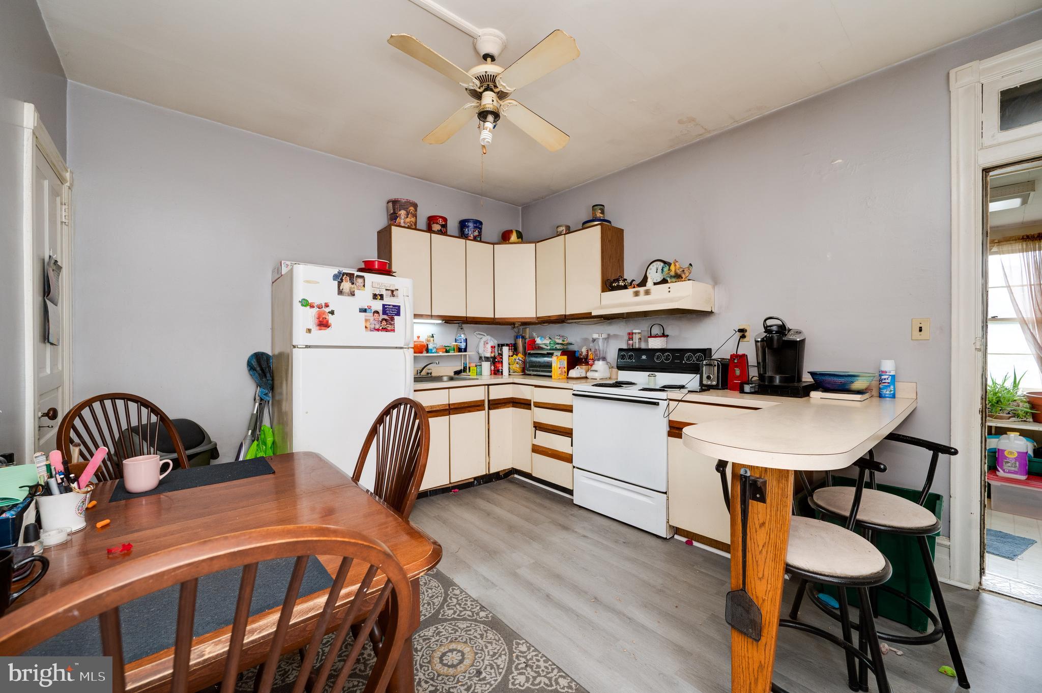 1642 Mineral Spring Road Reading, PA 19602 - Photo 15 of 56 a kitchen with a sink appliances and a chandelier