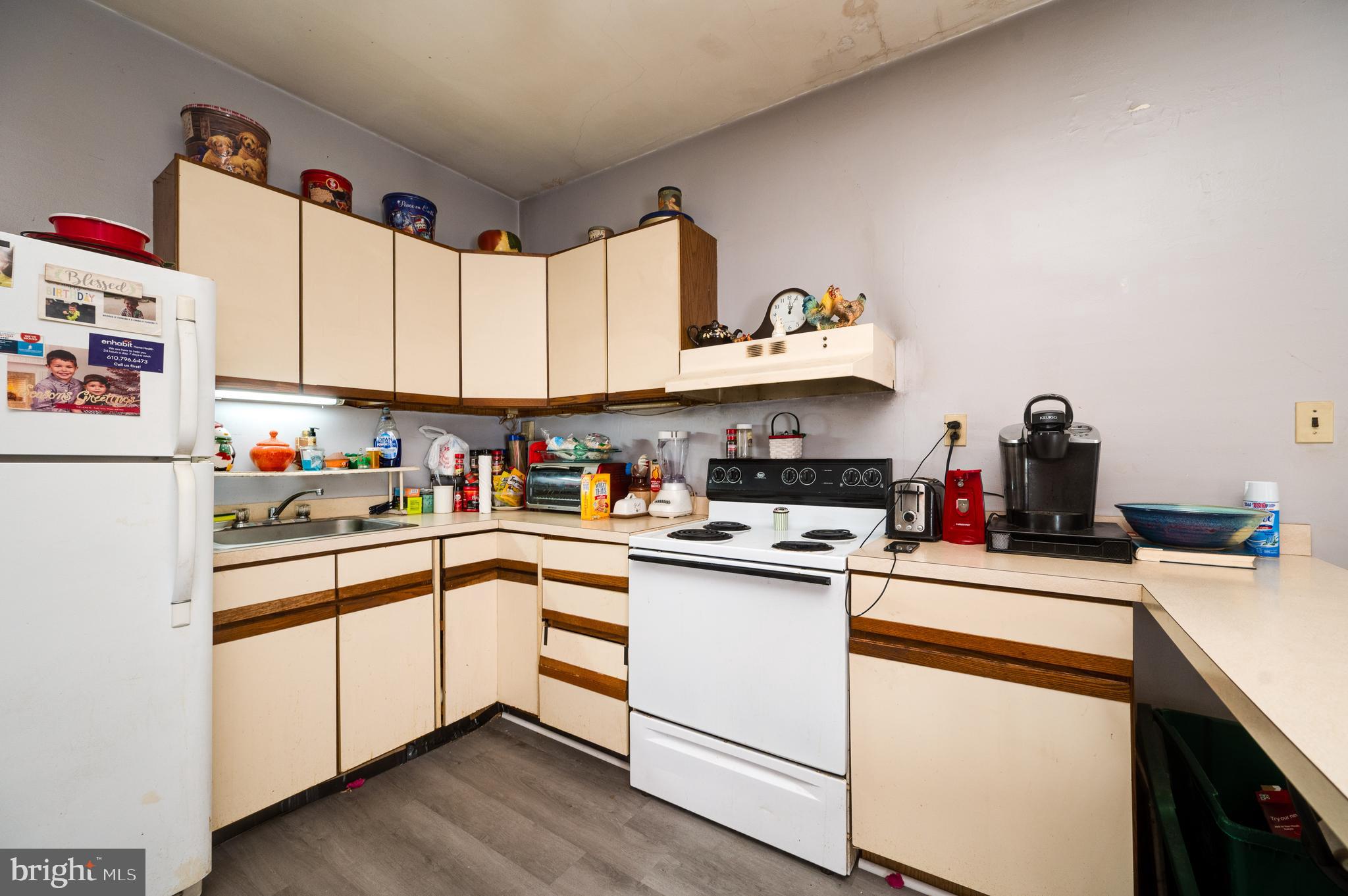 1642 Mineral Spring Road Reading, PA 19602 - Photo 17 of 56 a kitchen with appliances a sink and cabinets