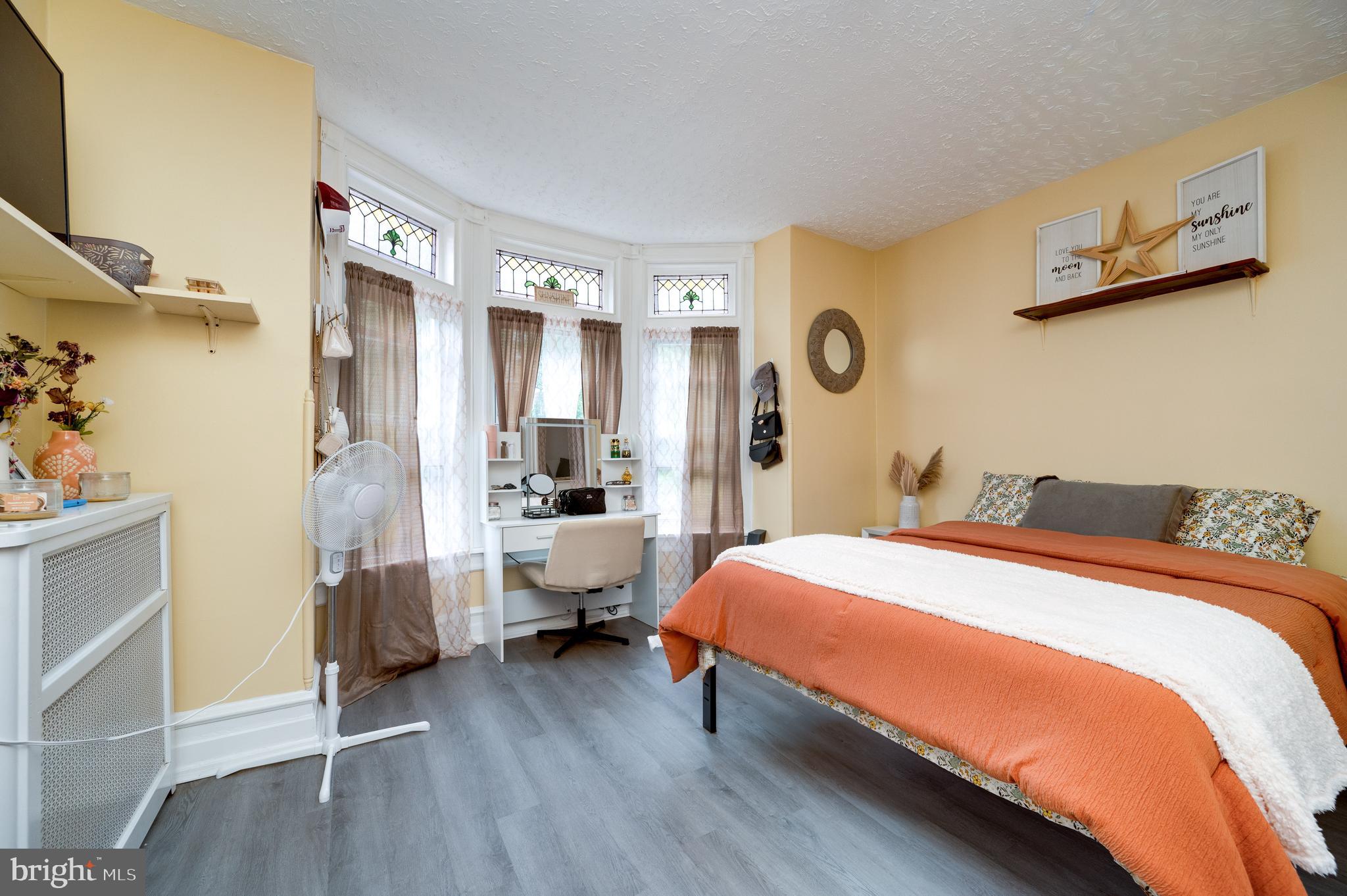 1642 Mineral Spring Road Reading, PA 19602 - Photo 22 of 56 a bedroom with a bed couch and a window