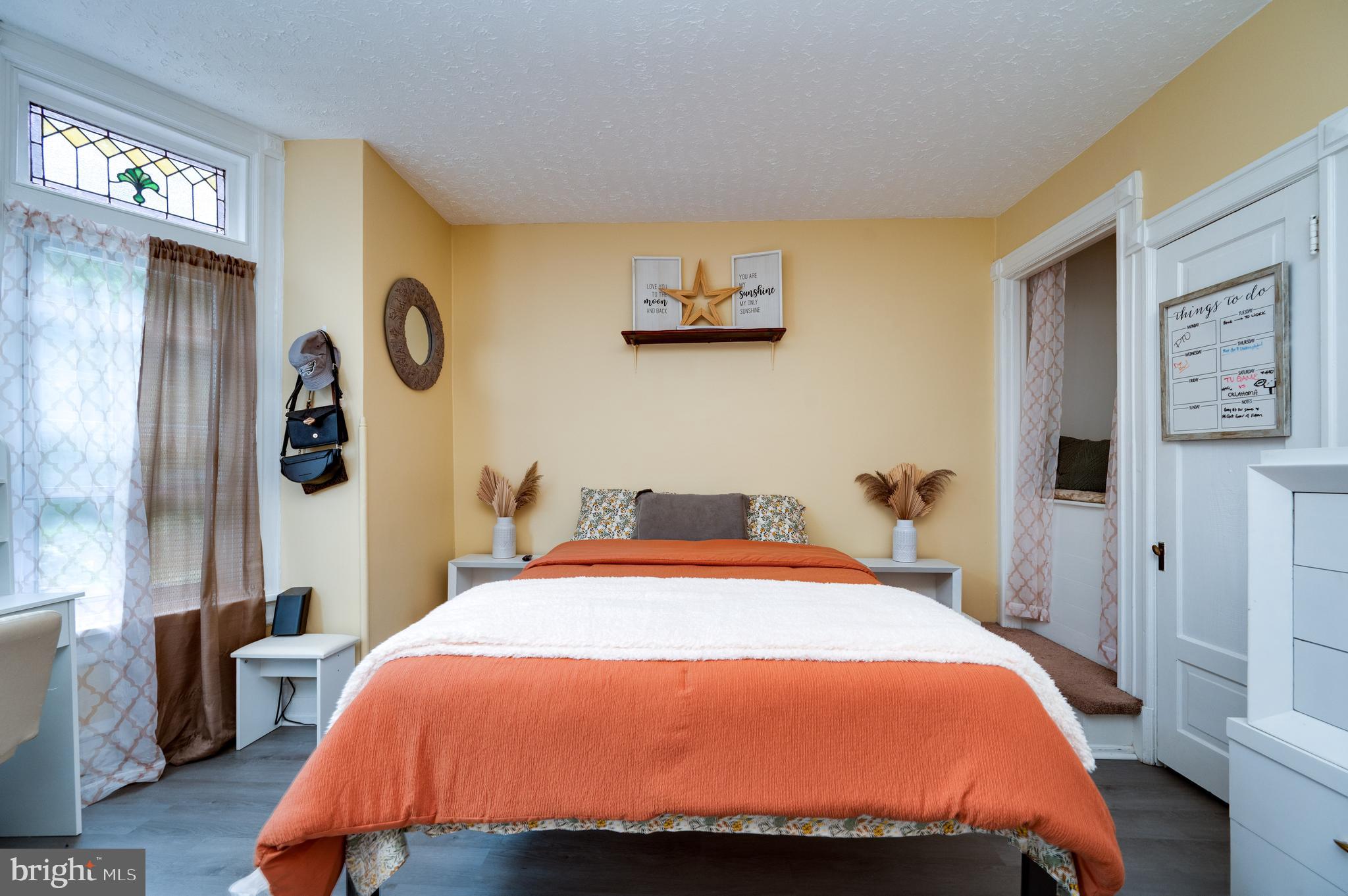 1642 Mineral Spring Road Reading, PA 19602 - Photo 23 of 56 a bed sitting in a bedroom next to a lamp