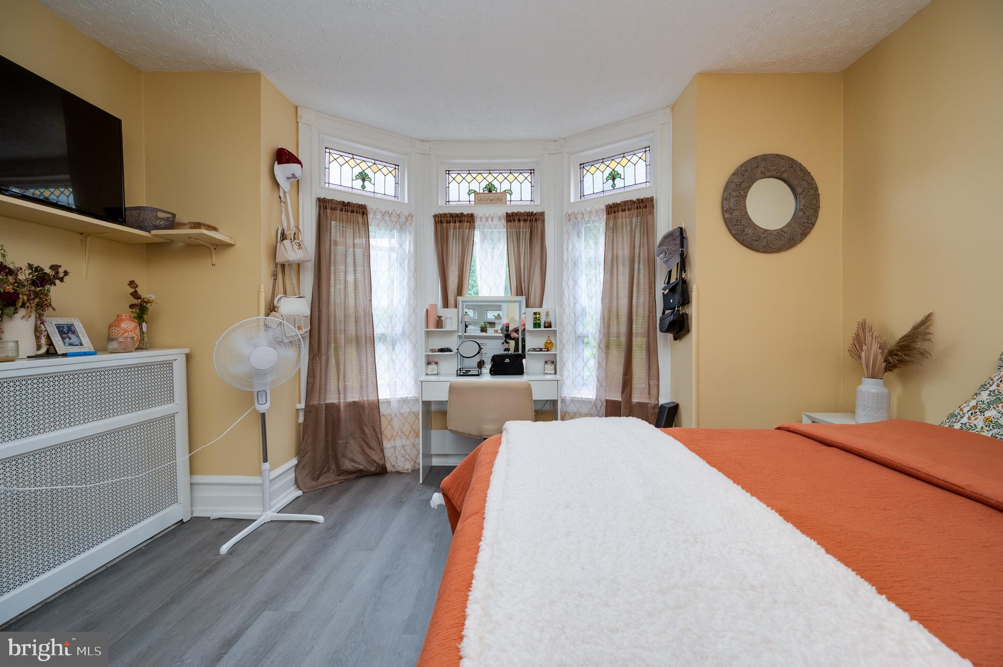1642 Mineral Spring Road Reading, PA 19602 - Photo 24 of 56 a bedroom with a bed and a flat tv screen on dresser