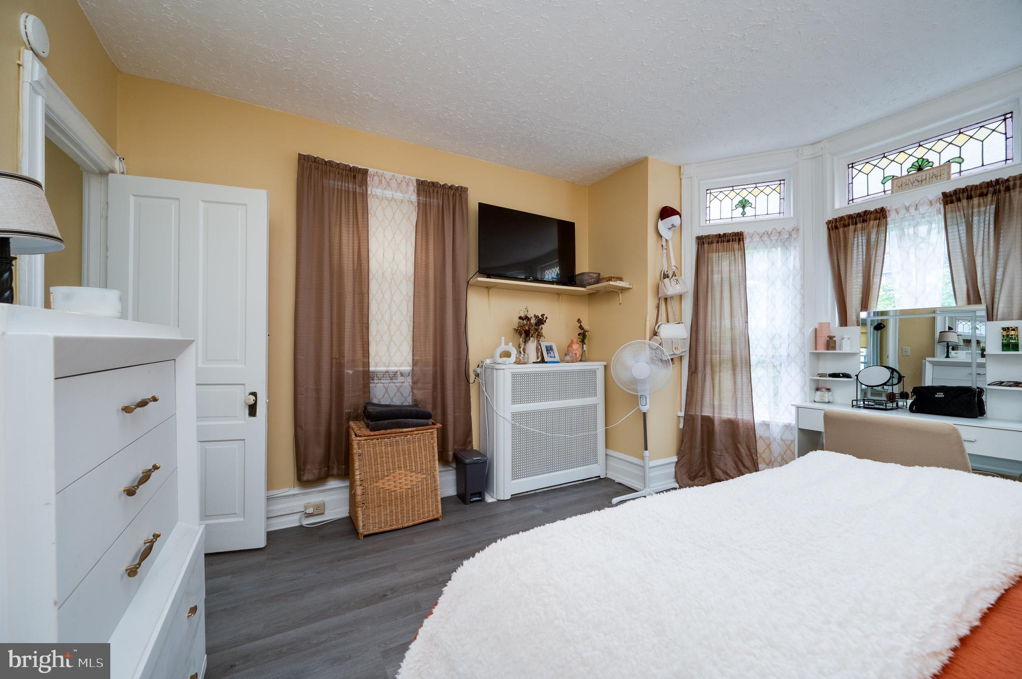 1642 Mineral Spring Road Reading, PA 19602 - Photo 25 of 56 a bedroom with a bed and a flat screen tv