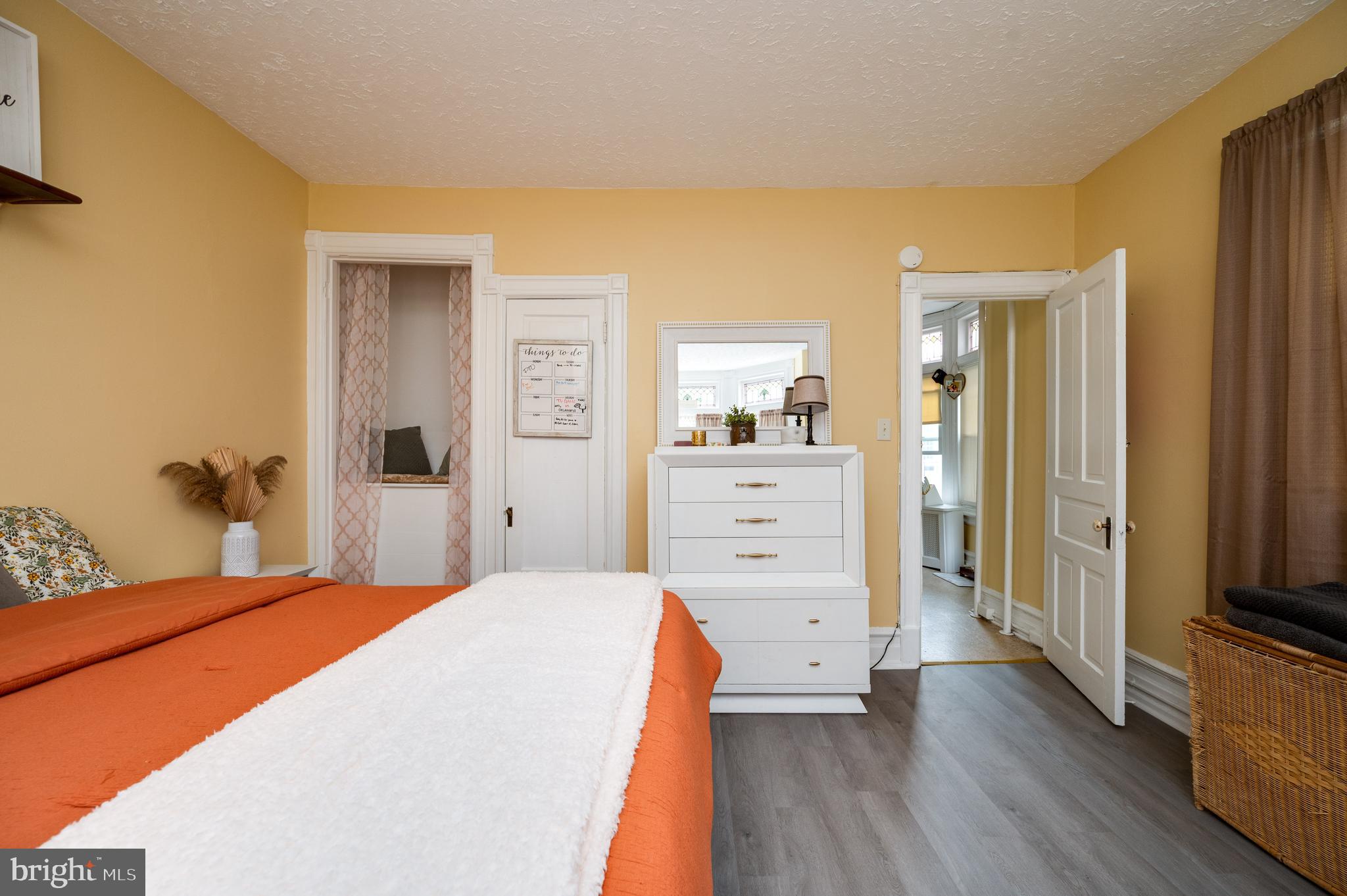 1642 Mineral Spring Road Reading, PA 19602 - Photo 26 of 56 a bedroom with a bed and a flat tv screen on dresser
