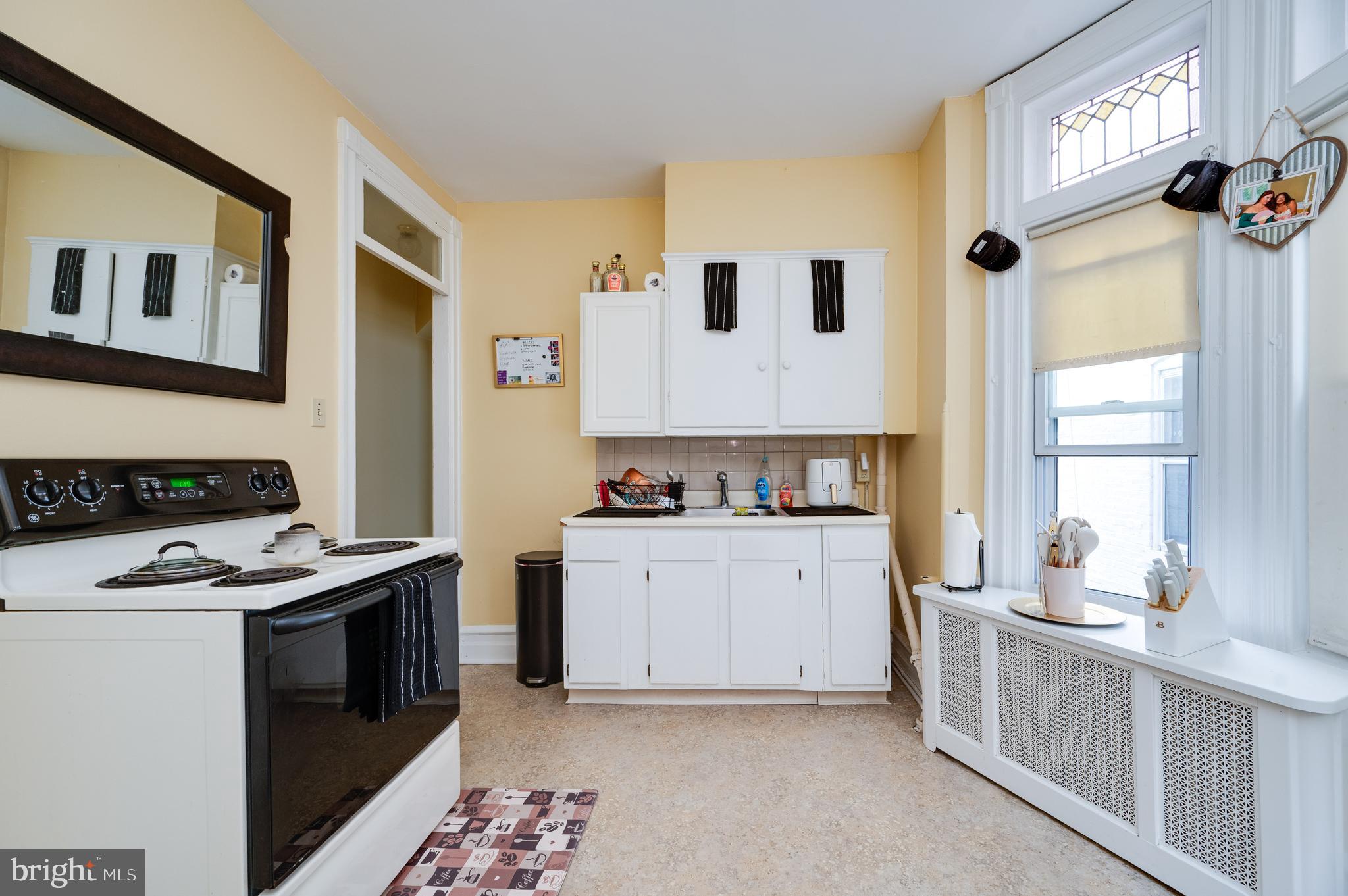 1642 Mineral Spring Road Reading, PA 19602 - Photo 27 of 56 a kitchen with a stove oven and sink