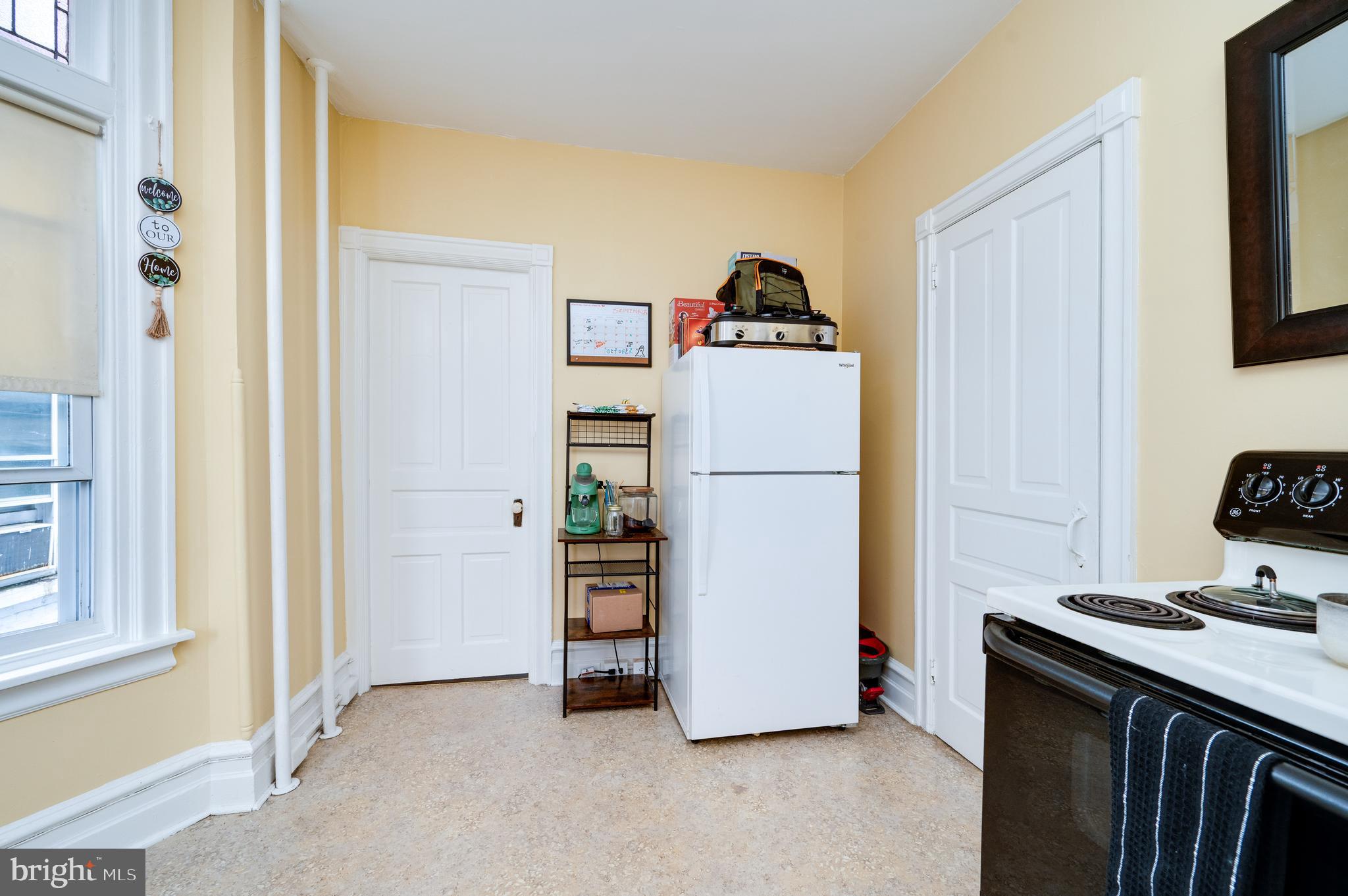 1642 Mineral Spring Road Reading, PA 19602 - Photo 30 of 56 a view of a storage & utility room with refrigerator and toys