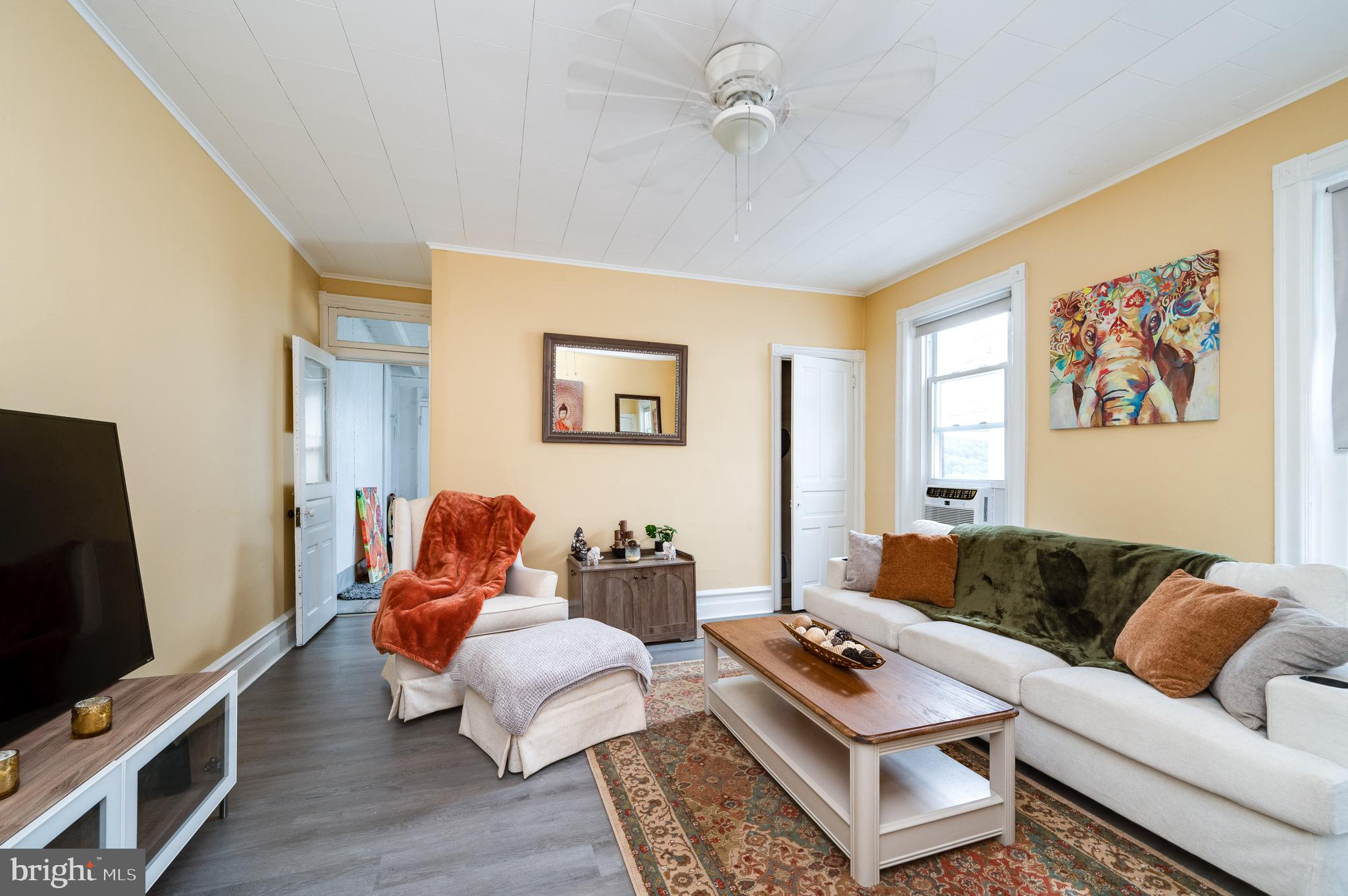 1642 Mineral Spring Road Reading, PA 19602 - Photo 33 of 56 a living room with furniture and a flat screen tv