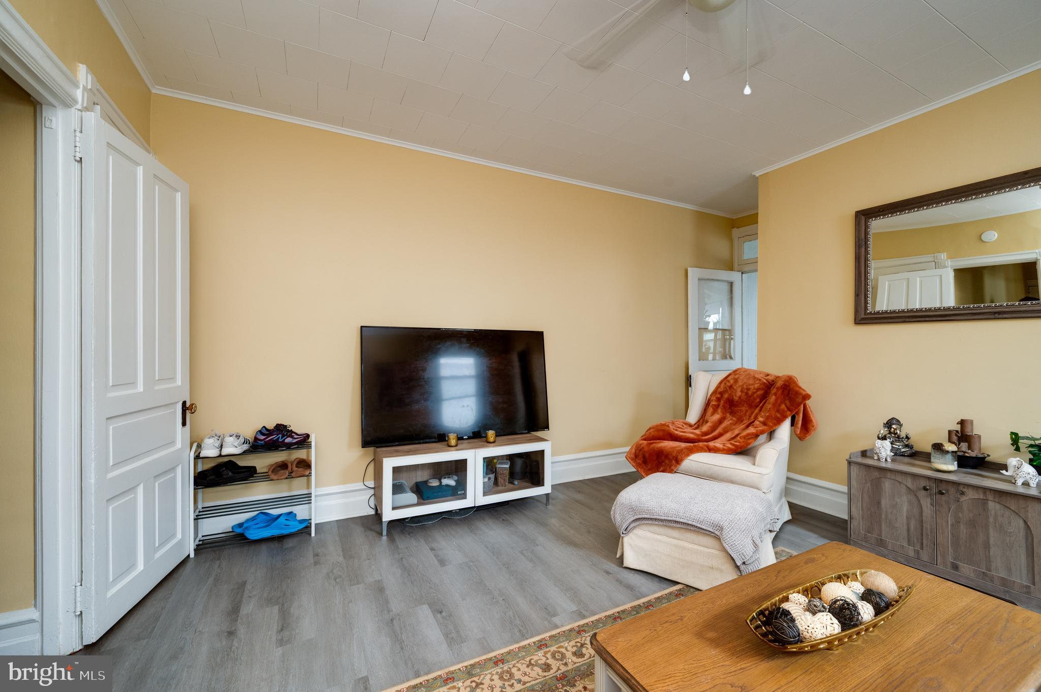1642 Mineral Spring Road Reading, PA 19602 - Photo 36 of 56 a living room with furniture and a flat screen tv