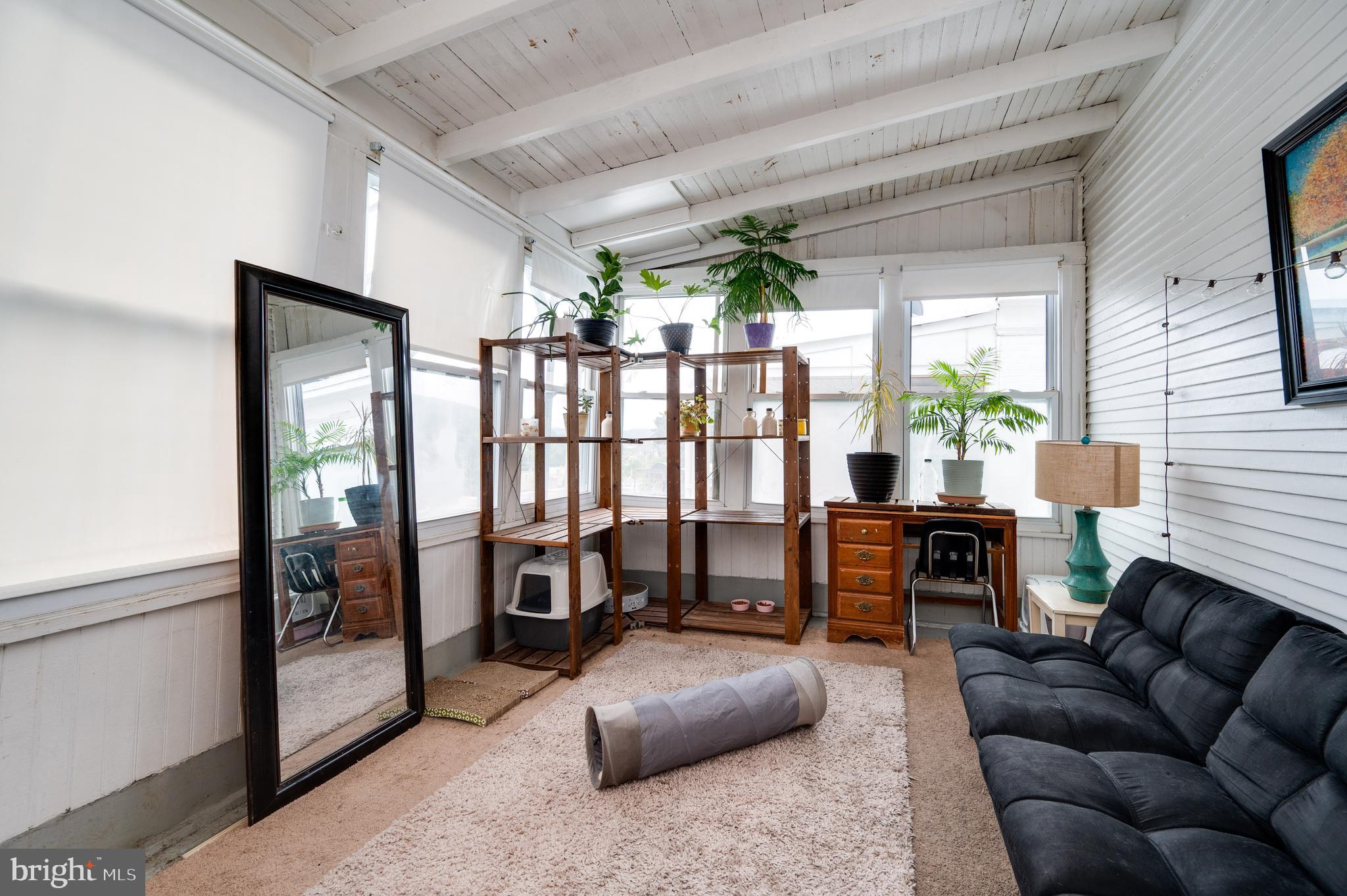 1642 Mineral Spring Road Reading, PA 19602 - Photo 38 of 56 a living room with furniture and a window