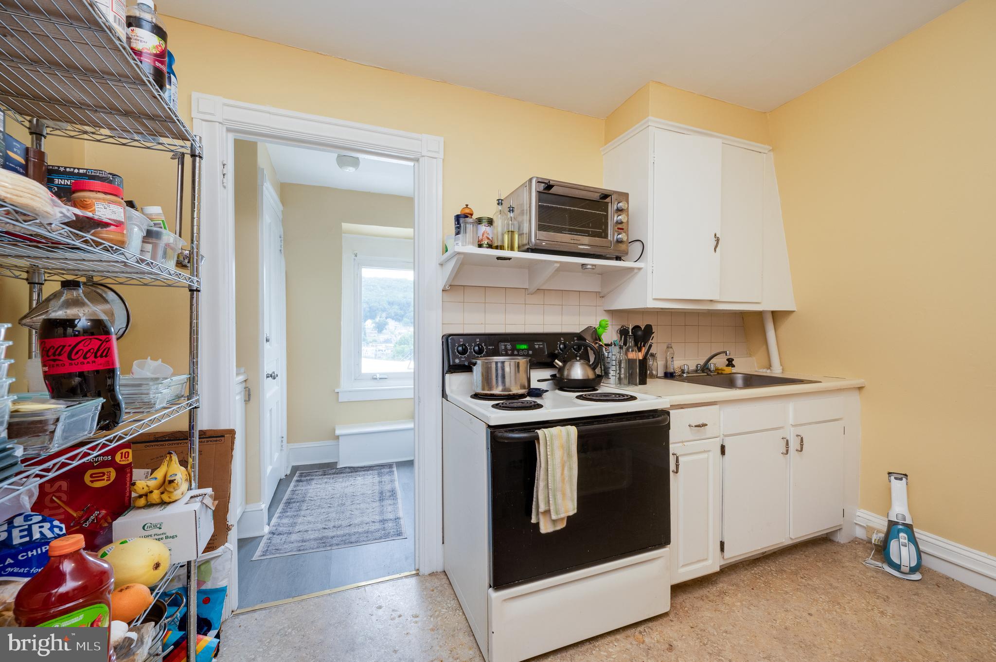 1642 Mineral Spring Road Reading, PA 19602 - Photo 47 of 56 a kitchen with stainless steel appliances granite countertop a stove and cabinets