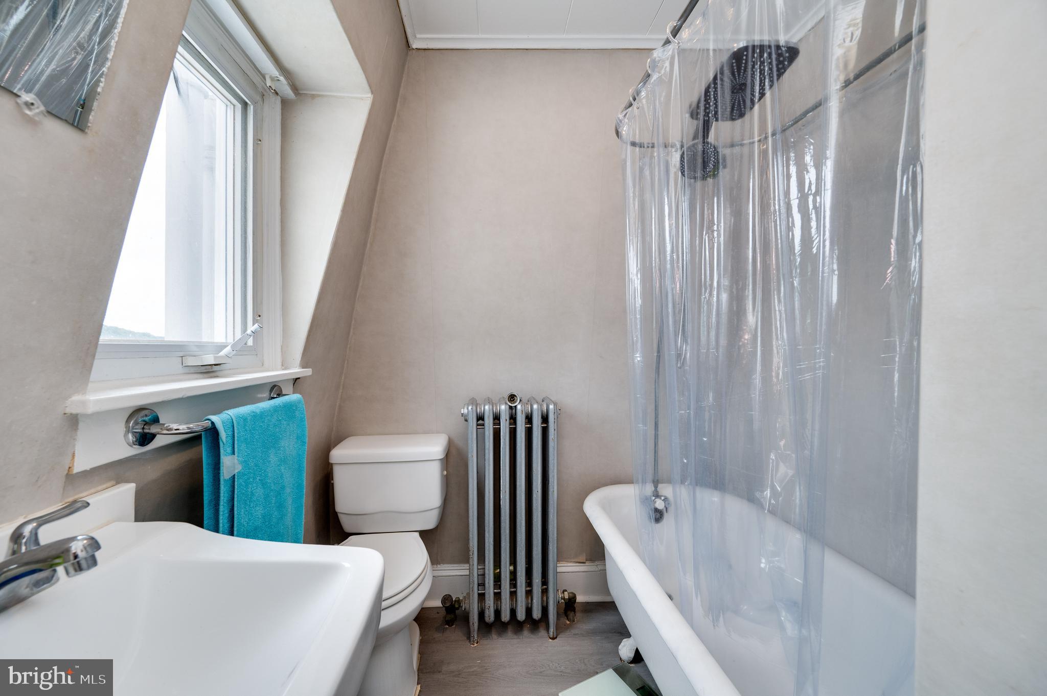 1642 Mineral Spring Road Reading, PA 19602 - Photo 48 of 56 a bathroom with a sink and a bathtub