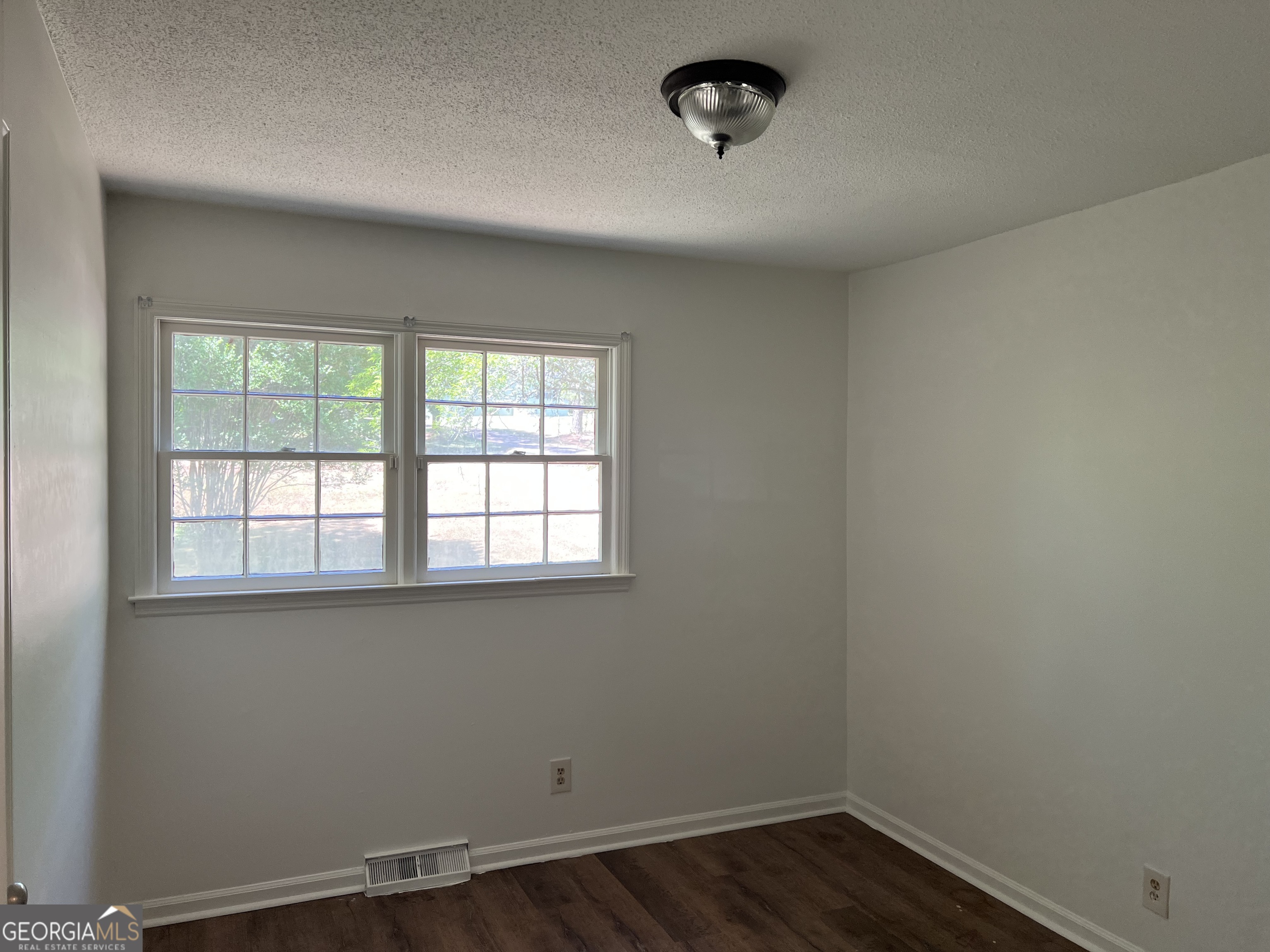156 Deacon J Simmons Road Southwest Milledgeville, GA 31061 - Photo 13 of 22 an empty room with a window