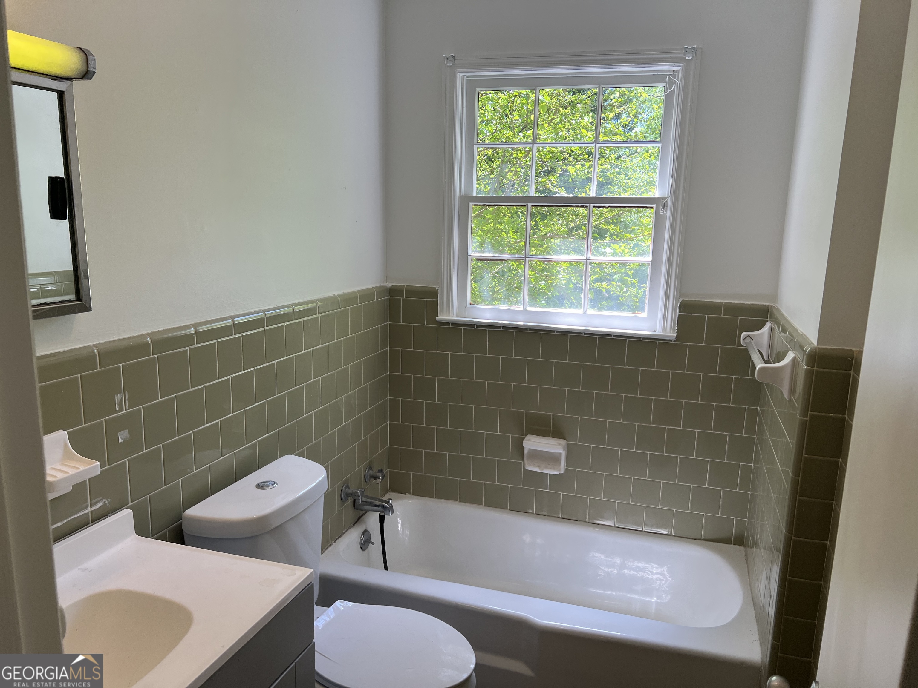 156 Deacon J Simmons Road Southwest Milledgeville, GA 31061 - Photo 19 of 22 a view of a bathroom with a tub and toilet
