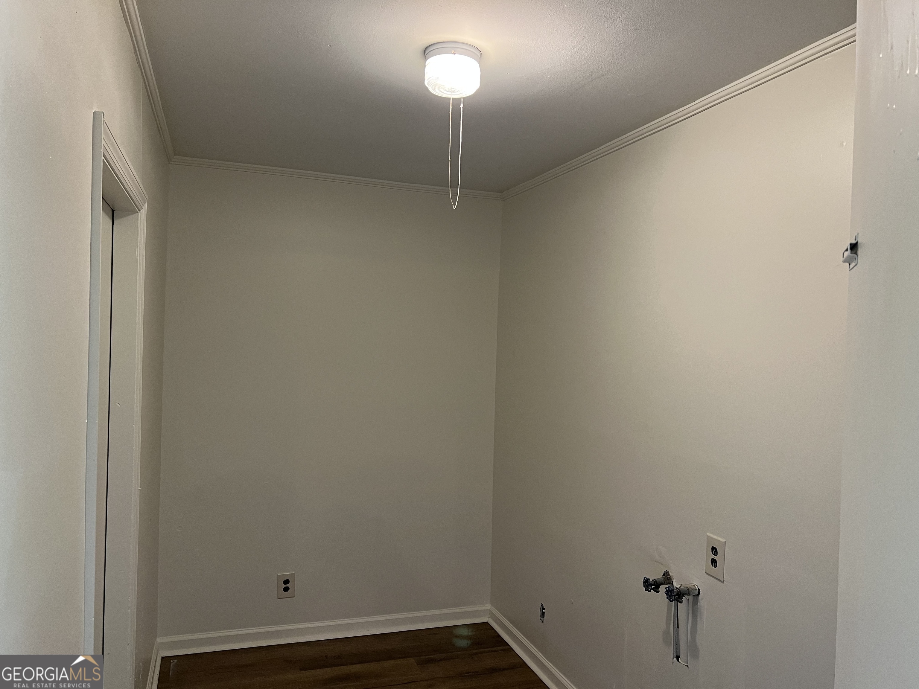 156 Deacon J Simmons Road Southwest Milledgeville, GA 31061 - Photo 22 of 22 a view of a room with rack on the wall