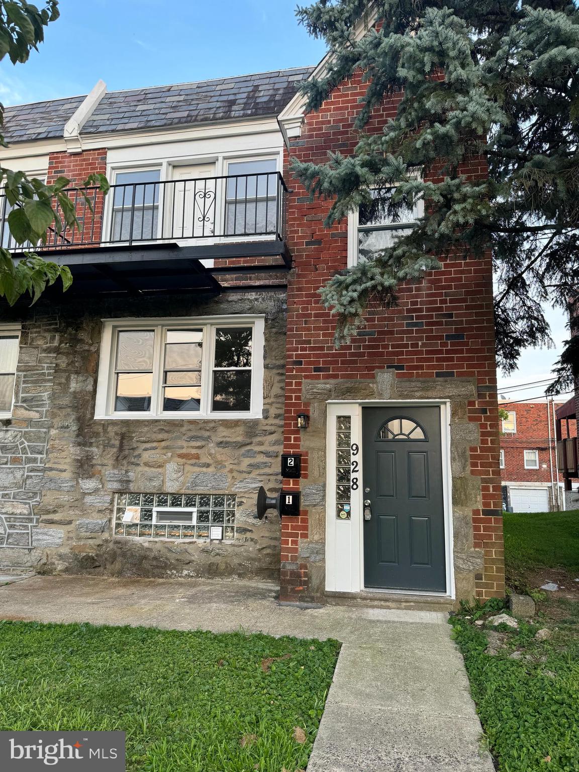 928 Durard Street Philadelphia, PA 19150 - Photo 2 of 8 a brick building with a large windows