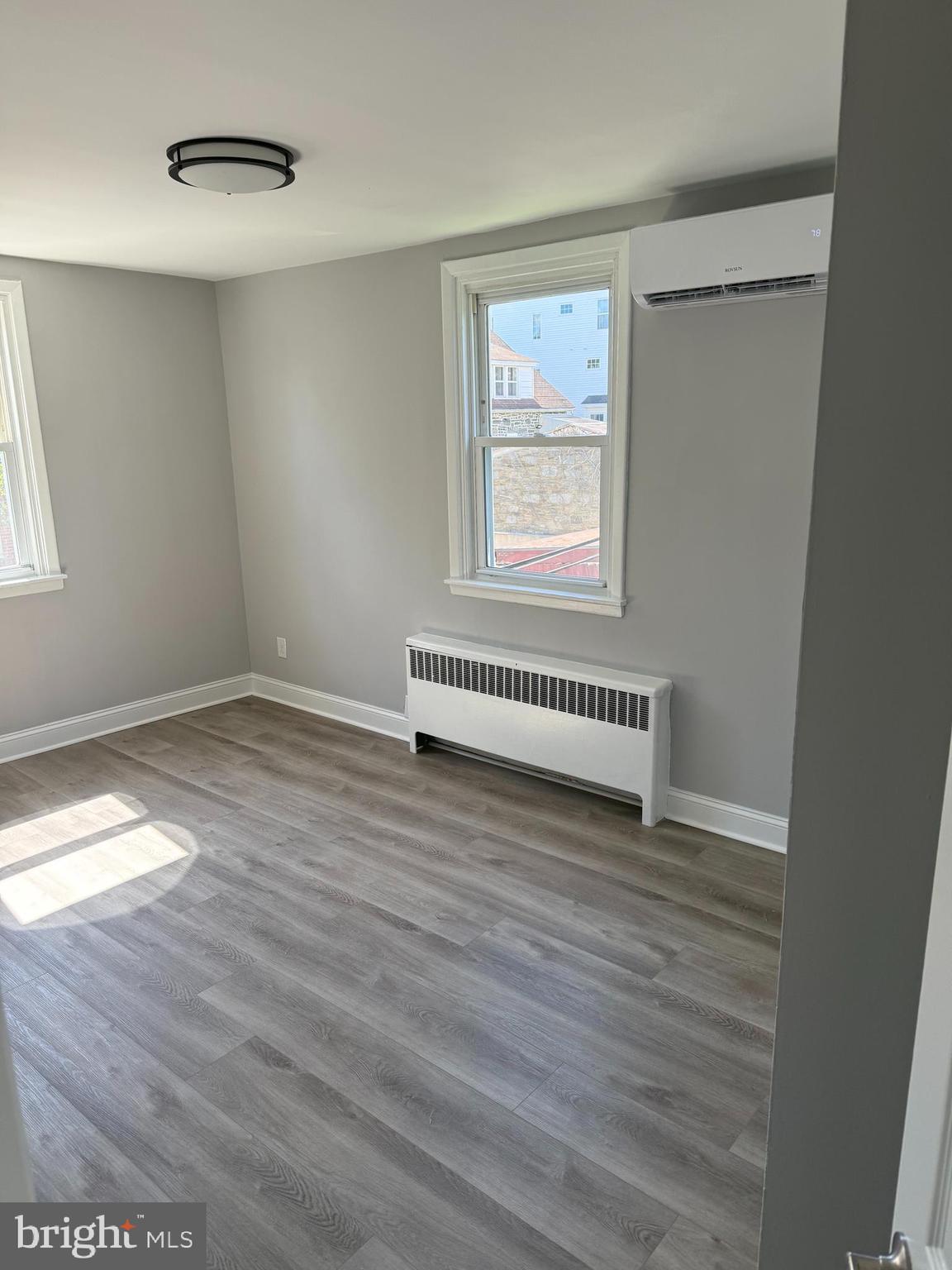 928 Durard Street Philadelphia, PA 19150 - Photo 6 of 8 a view of a room with wooden floor and white walls