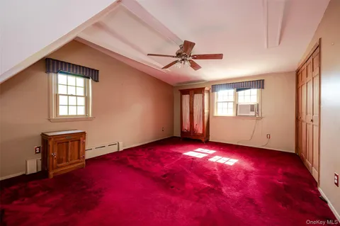 a view of empty room with windows