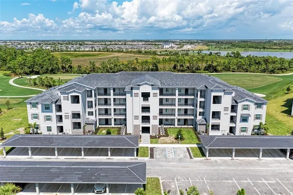 a aerial view of a large building with a yard