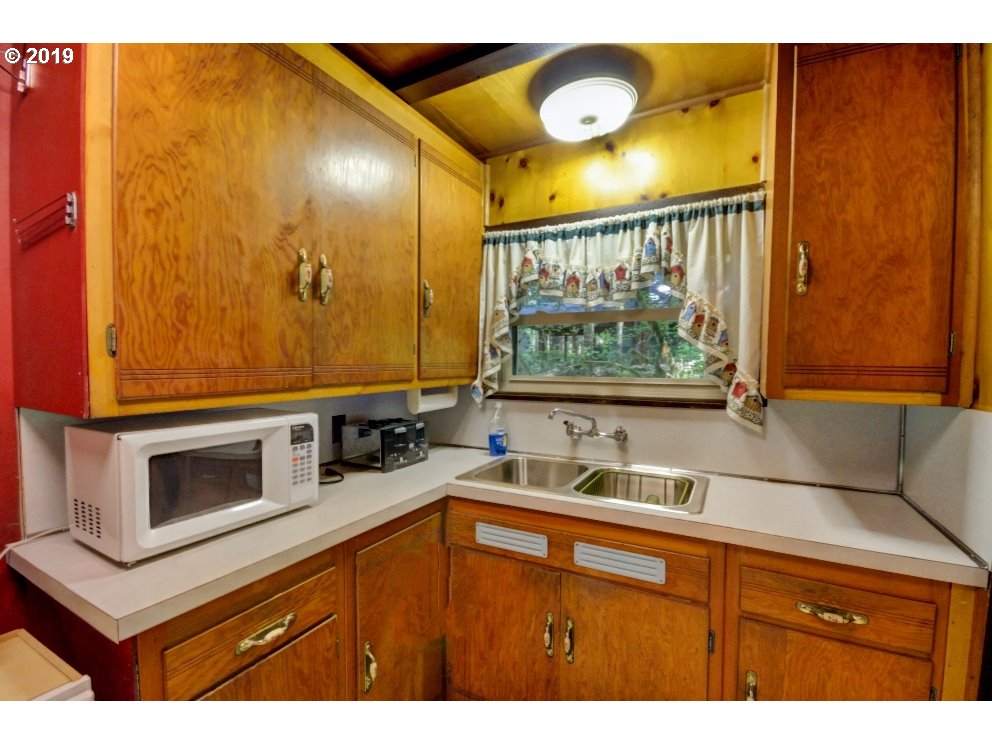 75774 East Road 28 Rhododendron, OR 97049 - Photo 11 of 26 a kitchen with a sink and a window