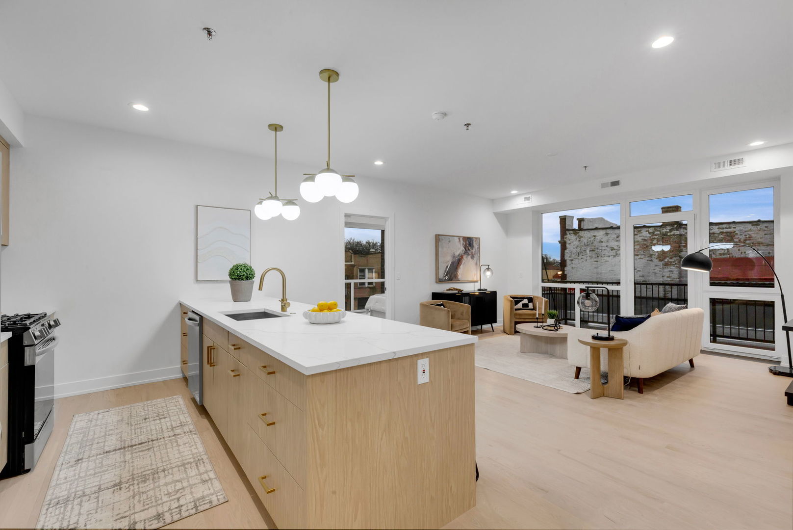 3204 North Kostner Avenue, Unit 506 Chicago, IL 60641 - Photo 9 of 23 a room with stainless steel appliances kitchen island granite countertop a sink and a living room view
