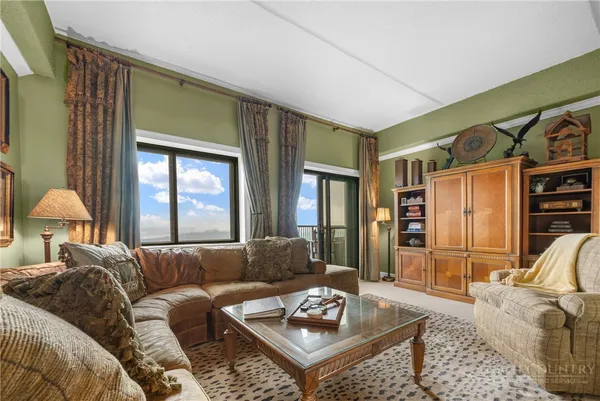 a living room with furniture and a window