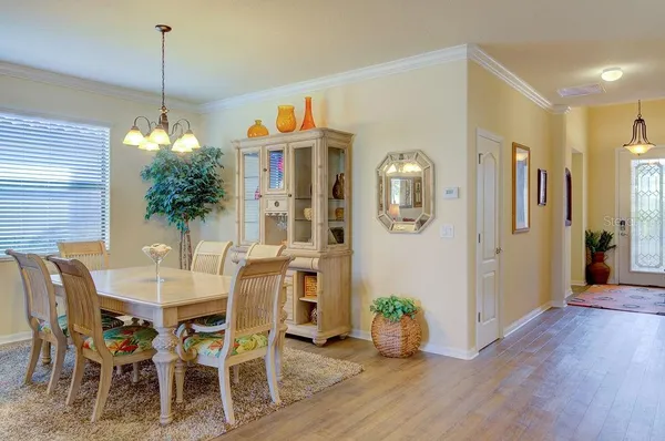 a bathroom with a tub a sink and a mirror