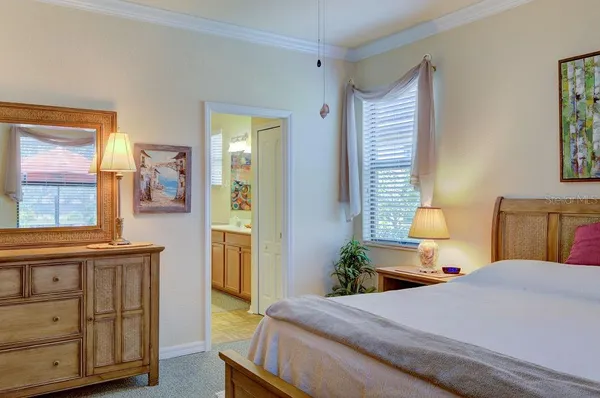 a bedroom with a bed and a dresser