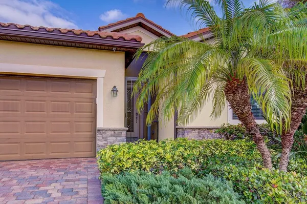 a bedroom with natural light and wooden floor
