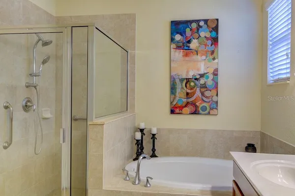 a bedroom with a bed and a lamp