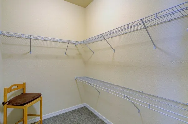 a bedroom with a bed and dresser