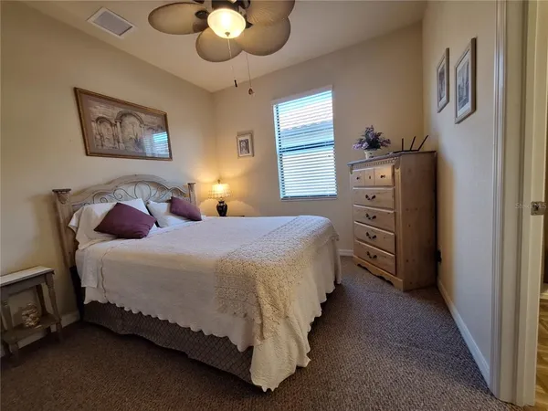 a view of a patio with a table chairs and a table