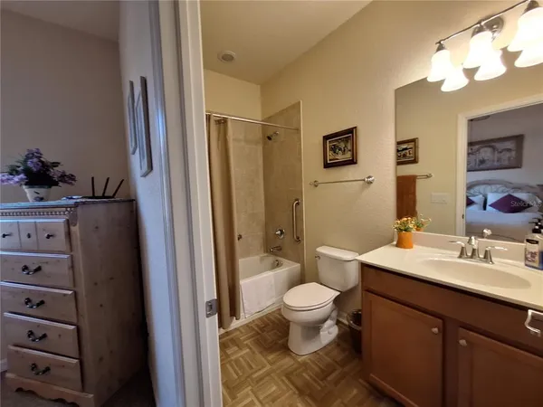 a view of a lake with houses in the back