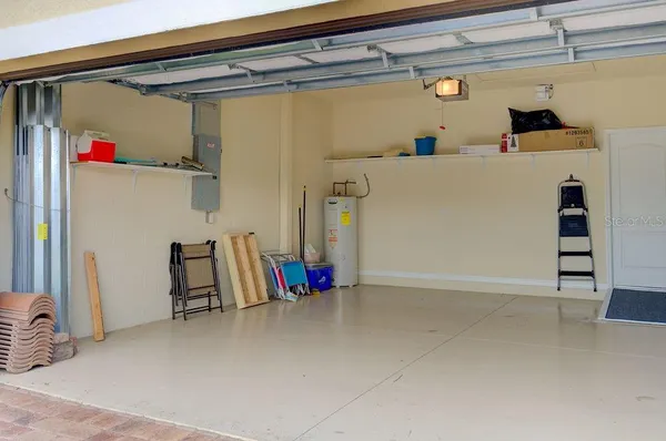a view of a livingroom with furniture and a window