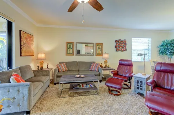 a kitchen with a kitchen island a stove a table and chairs in it