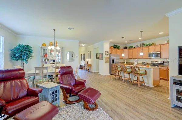 a kitchen with a stove a refrigerator and a sink
