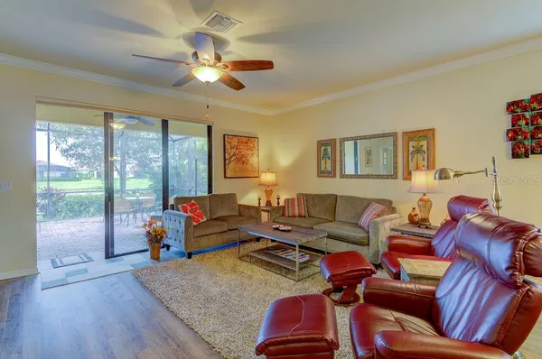 a kitchen with stainless steel appliances granite countertop a sink a refrigerator and microwave