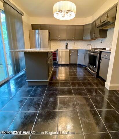5 Alameda Court Eatontown, NJ 07724 - Photo 2 of 12 a kitchen with a sink a stove and cabinets