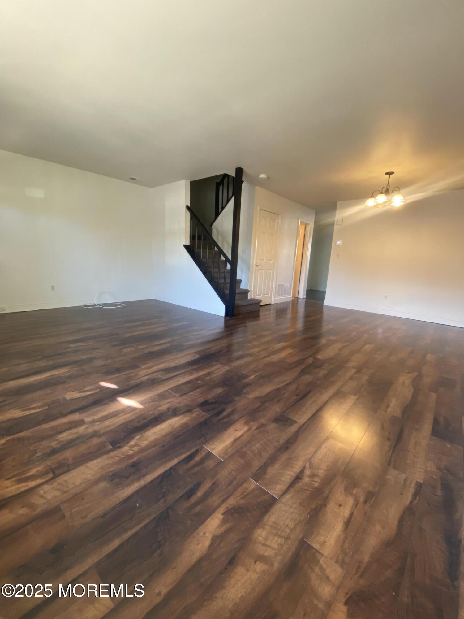 5 Alameda Court Eatontown, NJ 07724 - Photo 5 of 12 a view of empty room with wooden floor