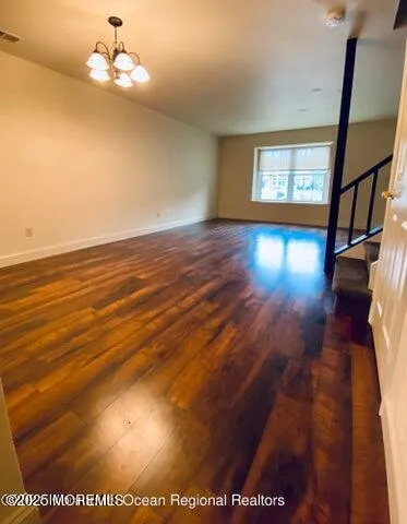 a view of livingroom with hardwood floor and window