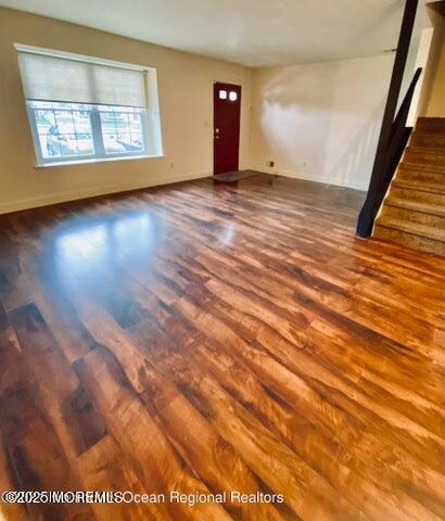 5 Alameda Court Eatontown, NJ 07724 - Photo 7 of 12 a view of an empty room with wooden floor and a window