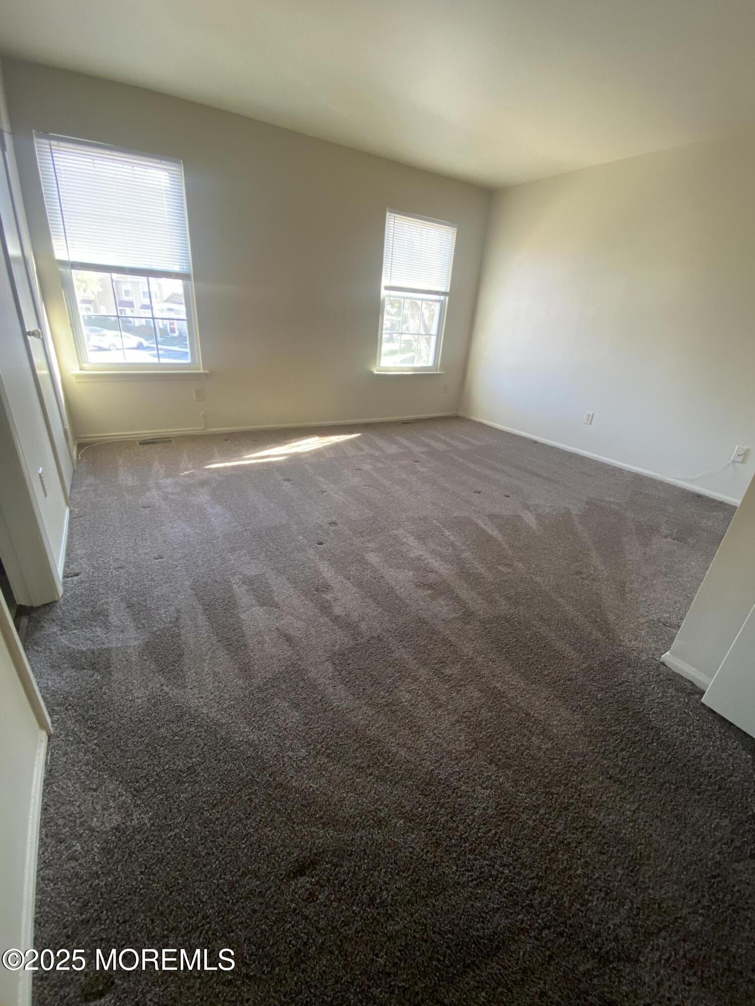 5 Alameda Court Eatontown, NJ 07724 - Photo 8 of 12 a view of an empty room with a window