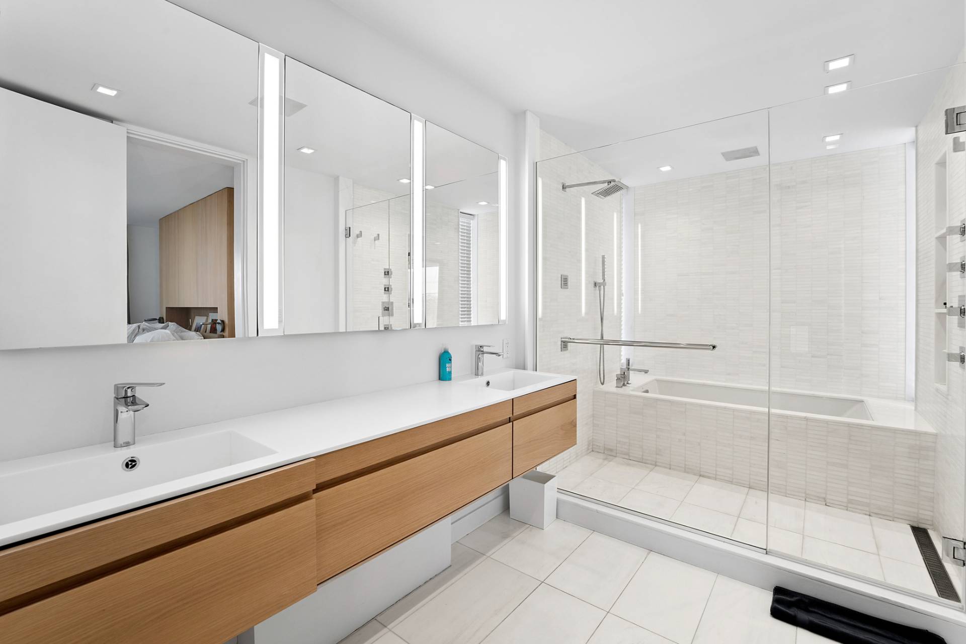 15 Deforest Road Montauk, NY 11954 - Photo 10 of 22 a bathroom with a bathtub shower sink and mirror