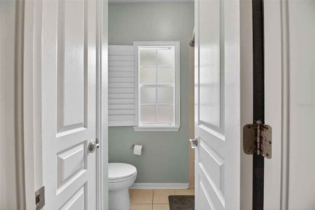 508 Islebay Drive Apollo Beach, FL 33572 - Photo 76 of 98 a white toilet sitting next to a bathroom sink
