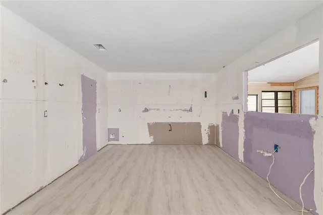 a view of a kitchen with wooden floor