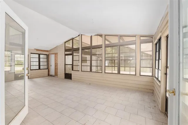 a view of an empty room with a balcony