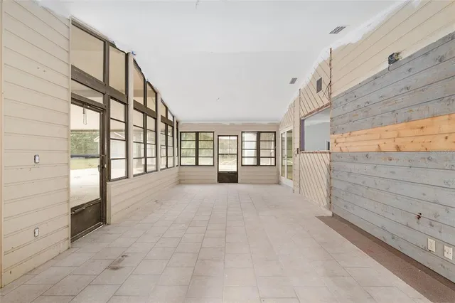 a view of an entryway with wooden floor