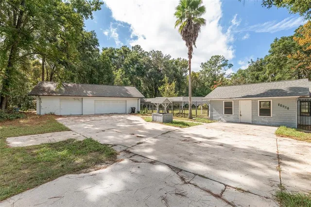 a view of a yard with entertaining space