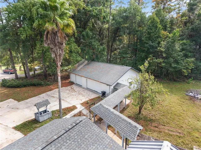 an aerial view of a house with outdoor space
