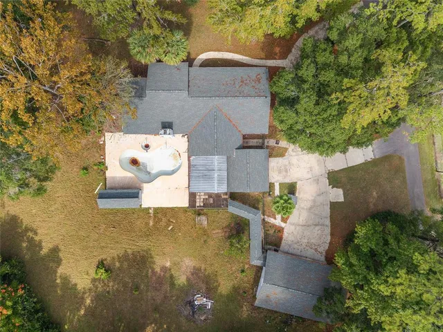 an aerial view of residential house with outdoor space