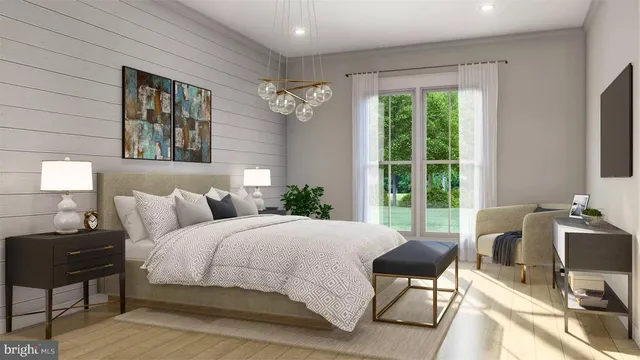 a bedroom with a bed and glass windows